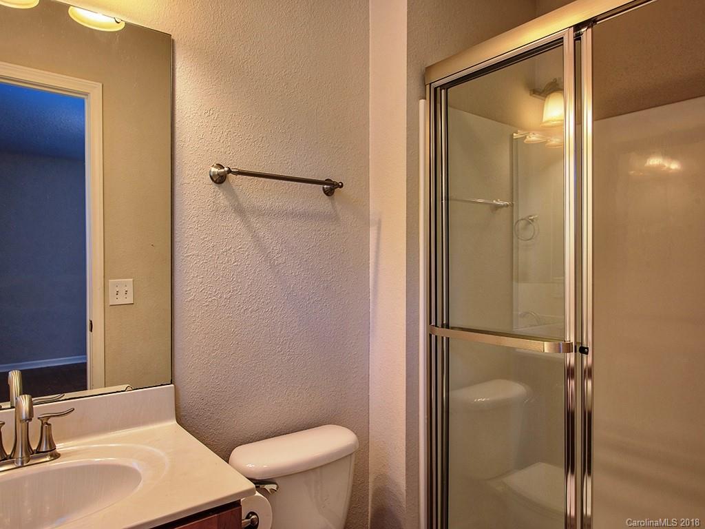 54 Barefoot Ridge Clyde, NC 28721 - Photo 17 of 24 a bathroom with a sink toilet and shower