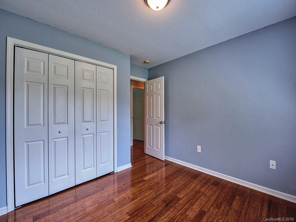 54 Barefoot Ridge Clyde, NC 28721 - Photo 20 of 24 a view of an empty room with wooden floor