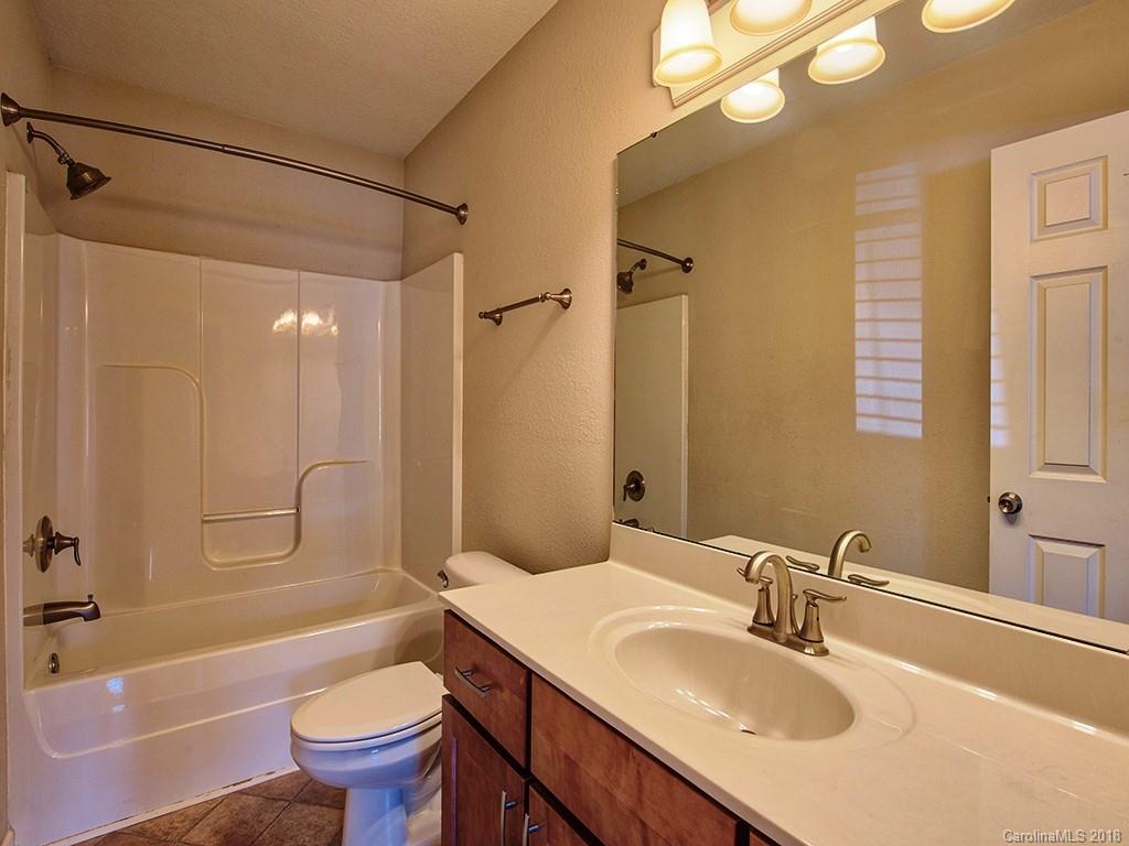 54 Barefoot Ridge Clyde, NC 28721 - Photo 21 of 24 a bathroom with a sink toilet tub and shower