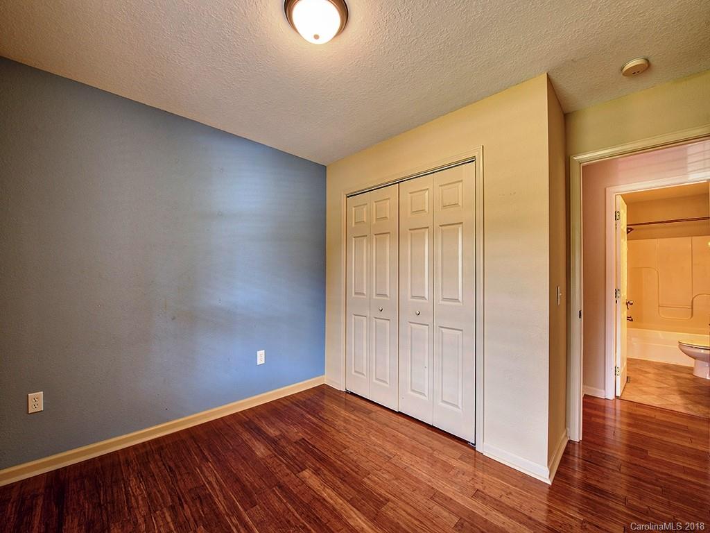 54 Barefoot Ridge Clyde, NC 28721 - Photo 23 of 24 a view of an empty room with wooden floor and a window