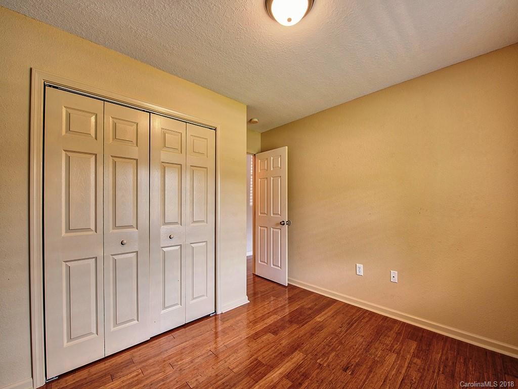 54 Barefoot Ridge Clyde, NC 28721 - Photo 24 of 24 a view of an empty room with wooden floor