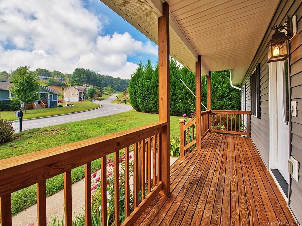 54 Barefoot Ridge Clyde, NC 28721 - Photo 4 of 24 a view of a wooden deck with a yard