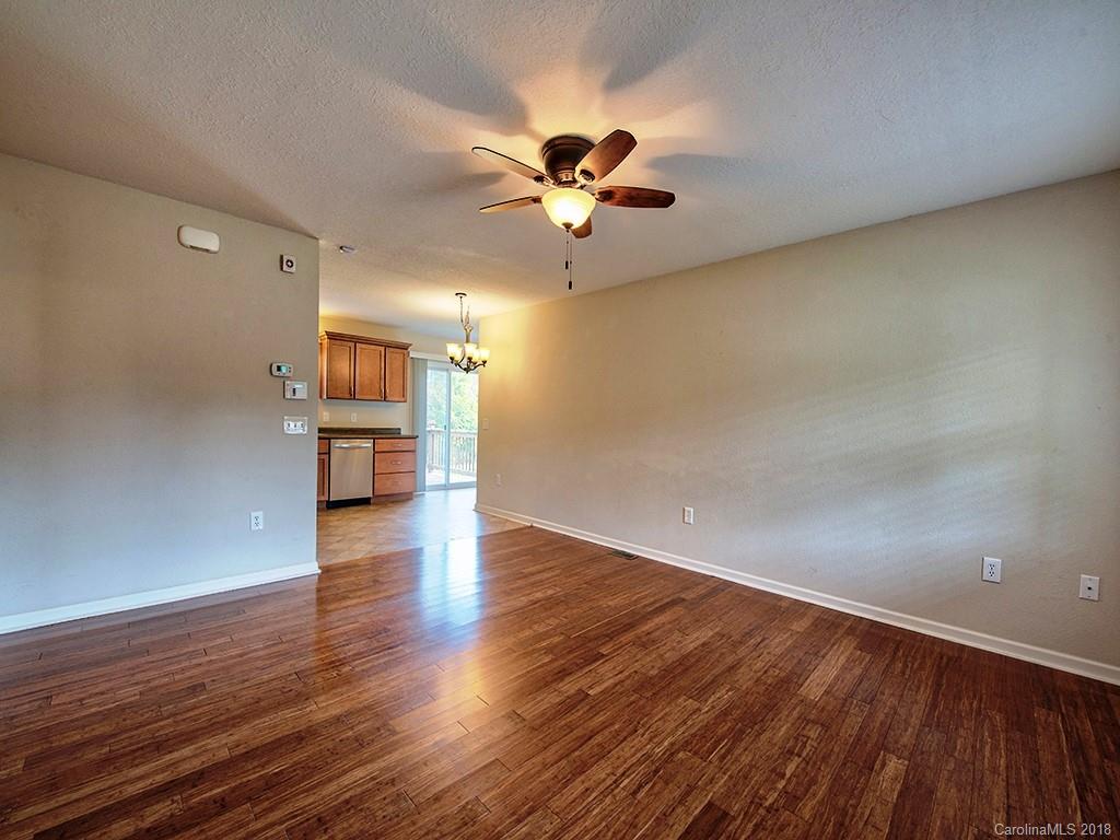 54 Barefoot Ridge Clyde, NC 28721 - Photo 7 of 24 wooden floor in an empty room with a window