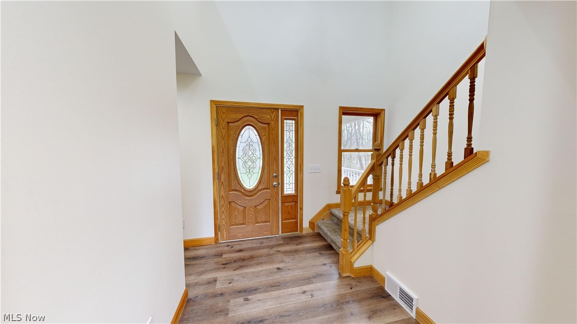 15548 Trask Road Thompson, OH 44086 - Photo 3 of 31 Entryway with light hardwood / wood-style flooring
