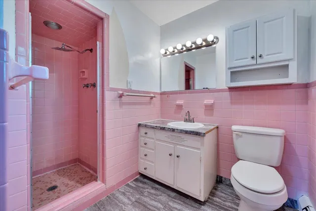 a bathroom with a granite countertop sink a mirror and a vanity