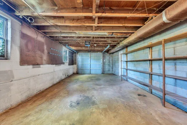 a kitchen with a stove cabinets and wooden floor