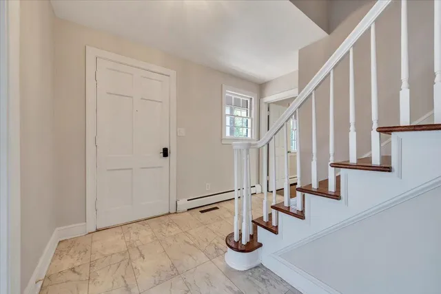 a view of an entryway with staircase