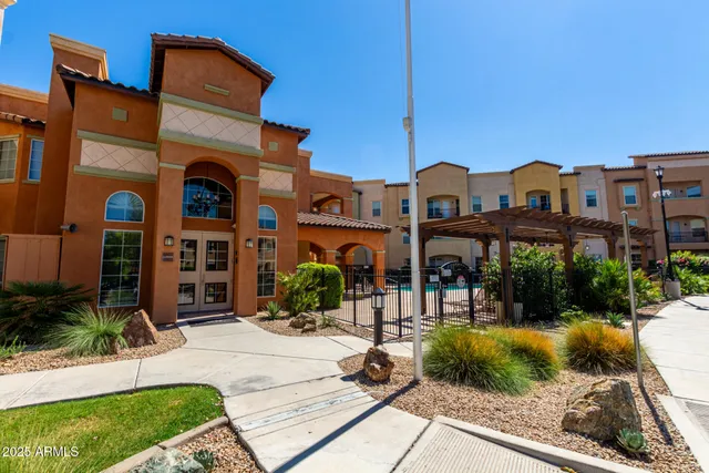 a front view of building with yard