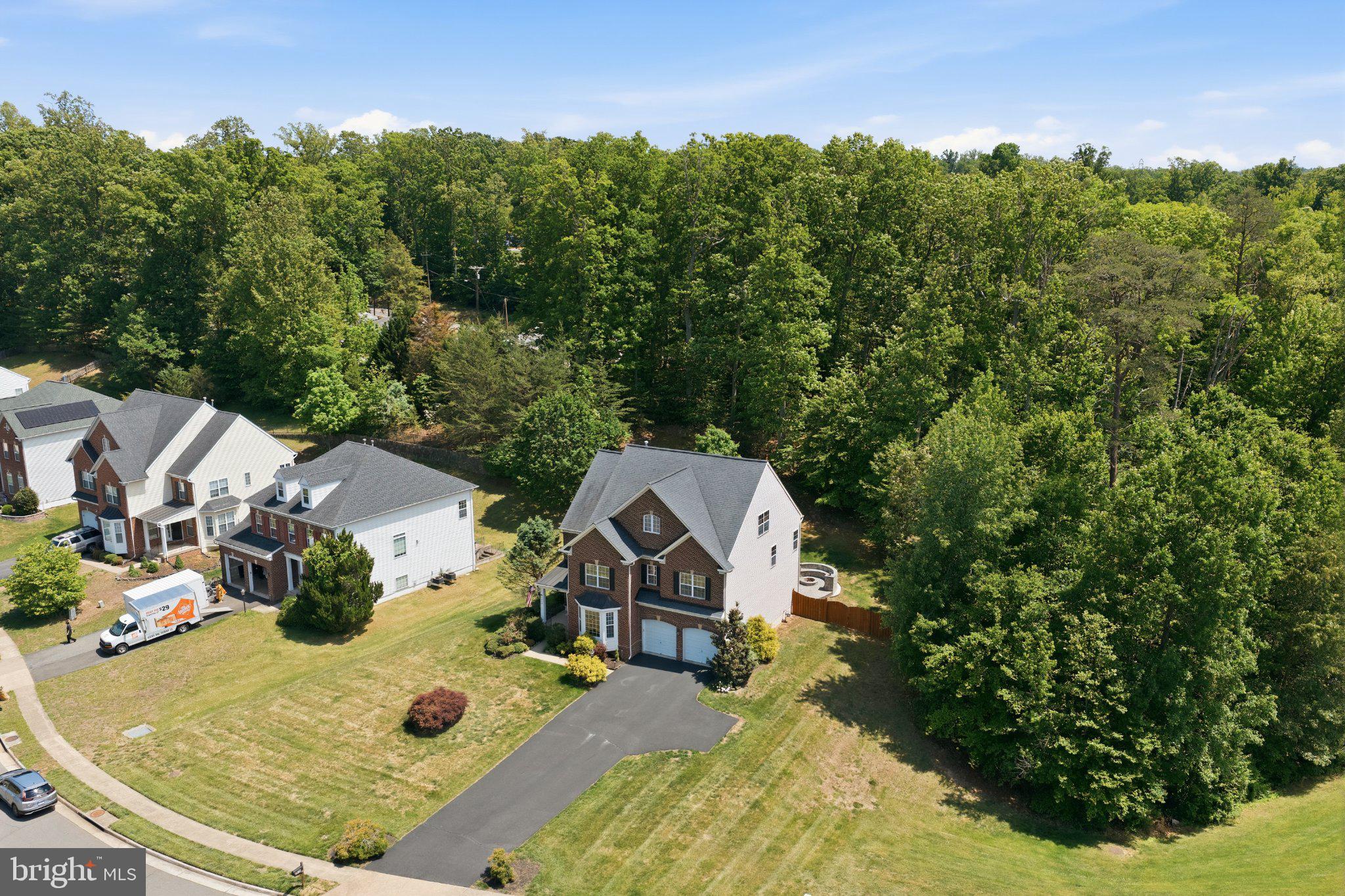 3679 Expedition Drive Triangle, VA 22172 - Photo 57 of 65 an aerial view of a house with yard swimming pool and mountain view