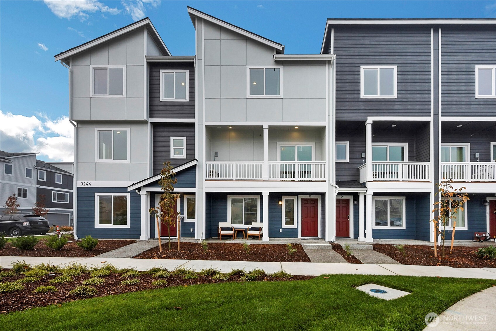 34370 Emerald Ridge Avenue Southeast Black Diamond, WA 98010 - Photo 1 of 12 a front view of a house with a yard