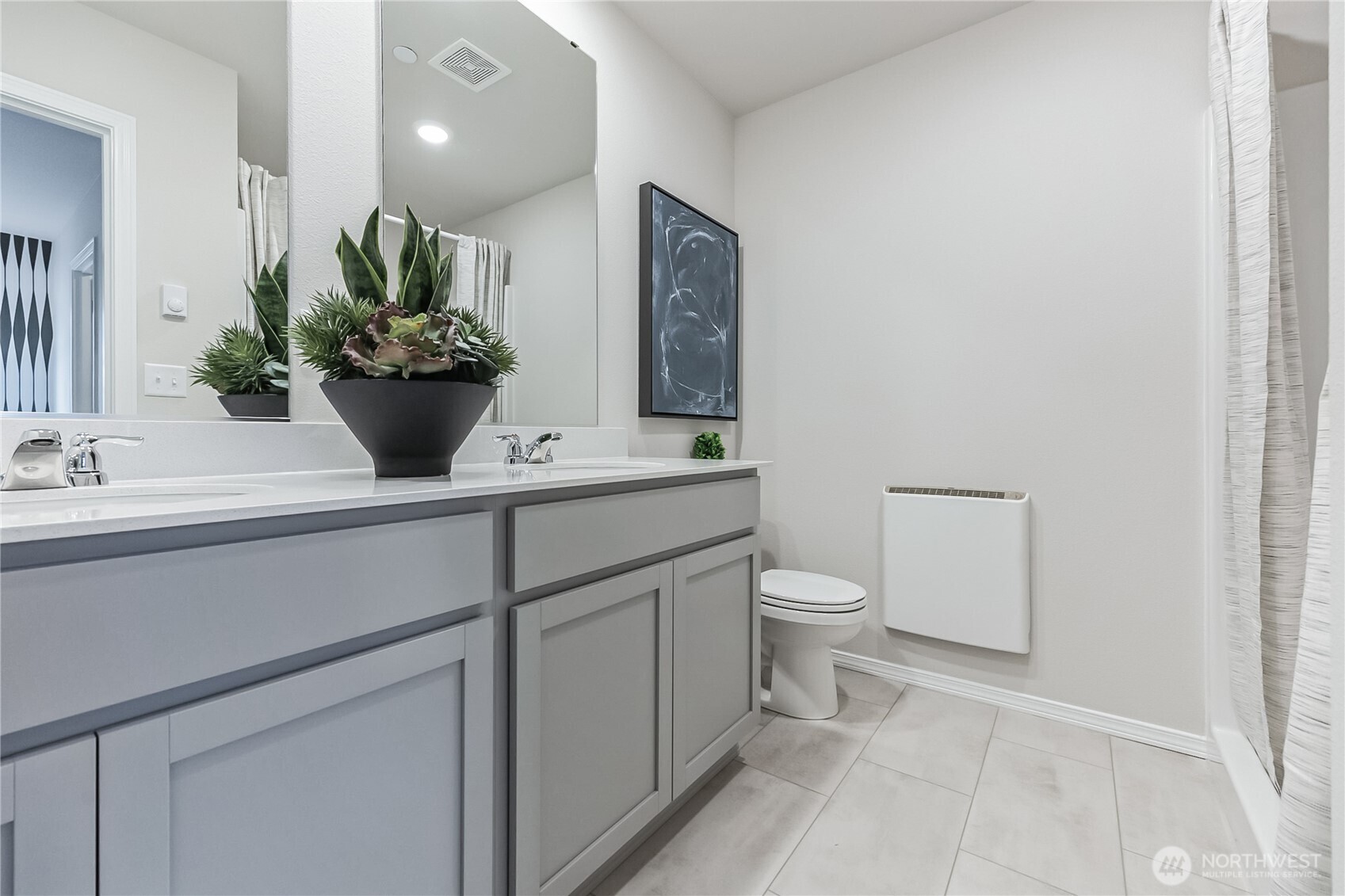34370 Emerald Ridge Avenue Southeast Black Diamond, WA 98010 - Photo 11 of 12 a bathroom with a toilet sink and mirror