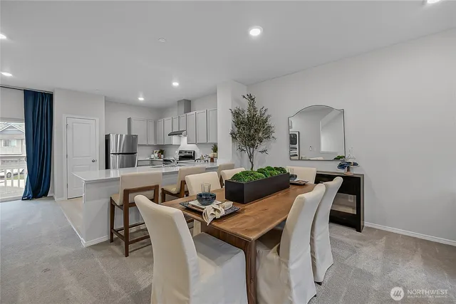 a view of a dining room with furniture