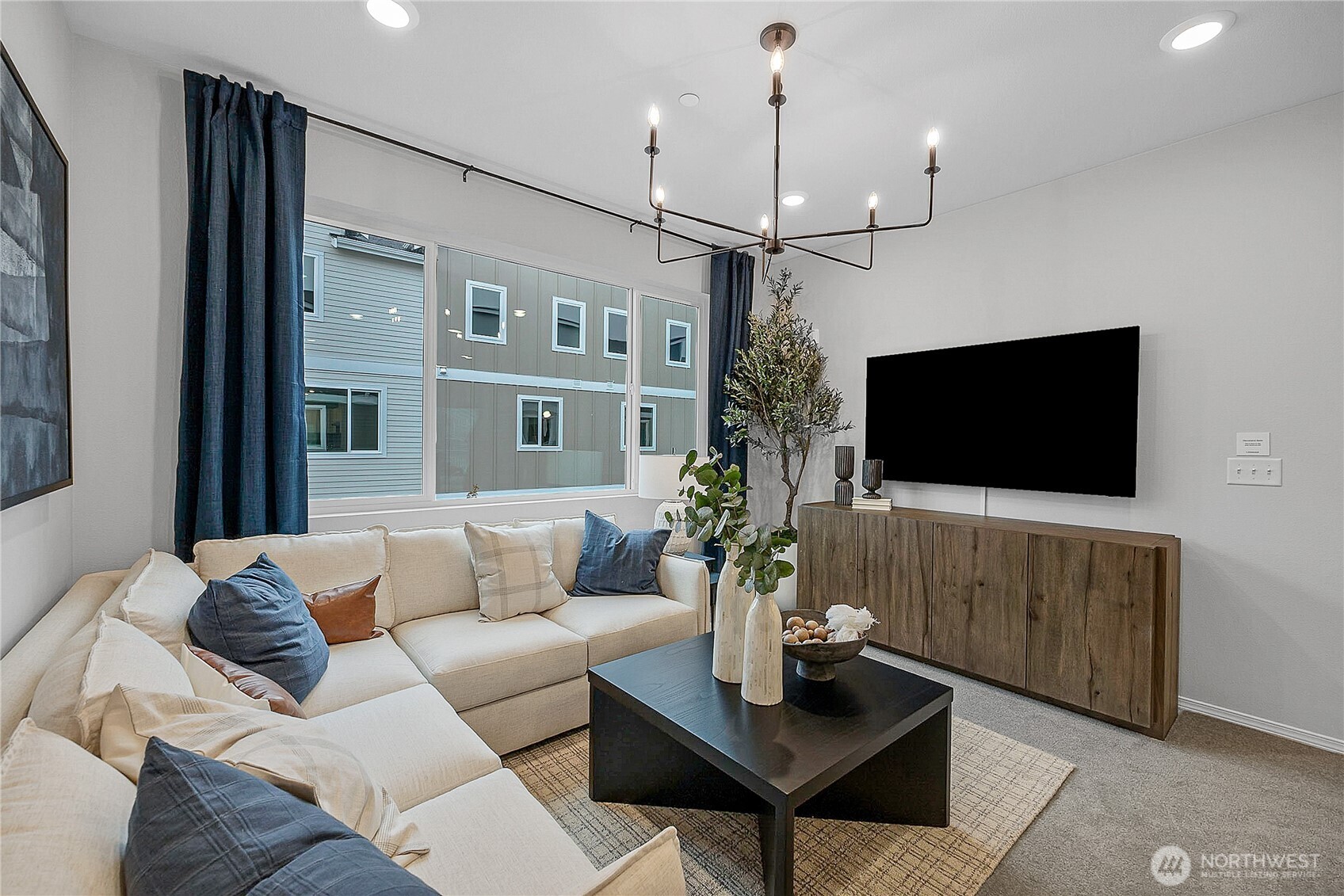 34370 Emerald Ridge Avenue Southeast Black Diamond, WA 98010 - Photo 6 of 12 a living room with furniture and a flat screen tv