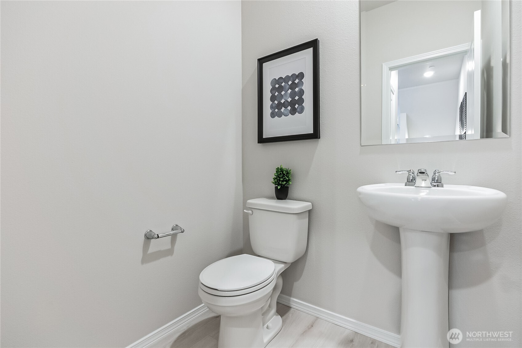 34370 Emerald Ridge Avenue Southeast Black Diamond, WA 98010 - Photo 10 of 12 a bathroom with a toilet sink and mirror