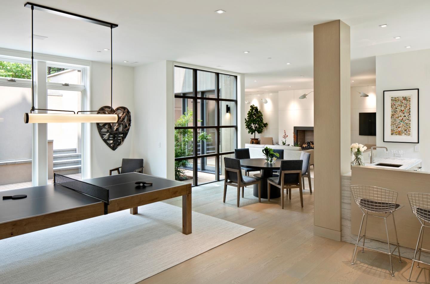 440 Walsh Road Atherton, CA 94027 - Photo 8 of 17 a living room with furniture a flat screen tv and a large window