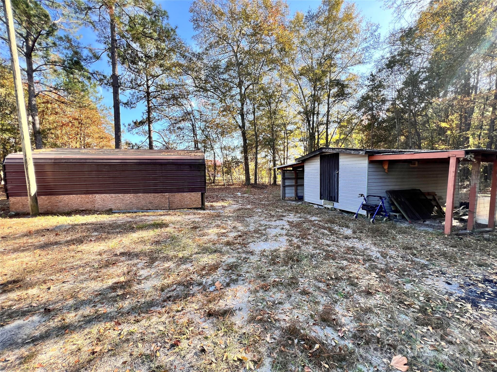 405 West Inwood Street Bethune, SC 29009 - Photo 16 of 22 a view of a house with a yard