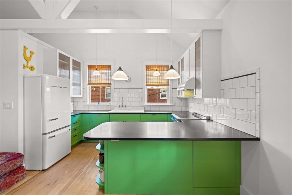 22 Mitchell Street, Unit 1 Boston, MA 02127 - Photo 1 of 41 a living room with furniture and a large window