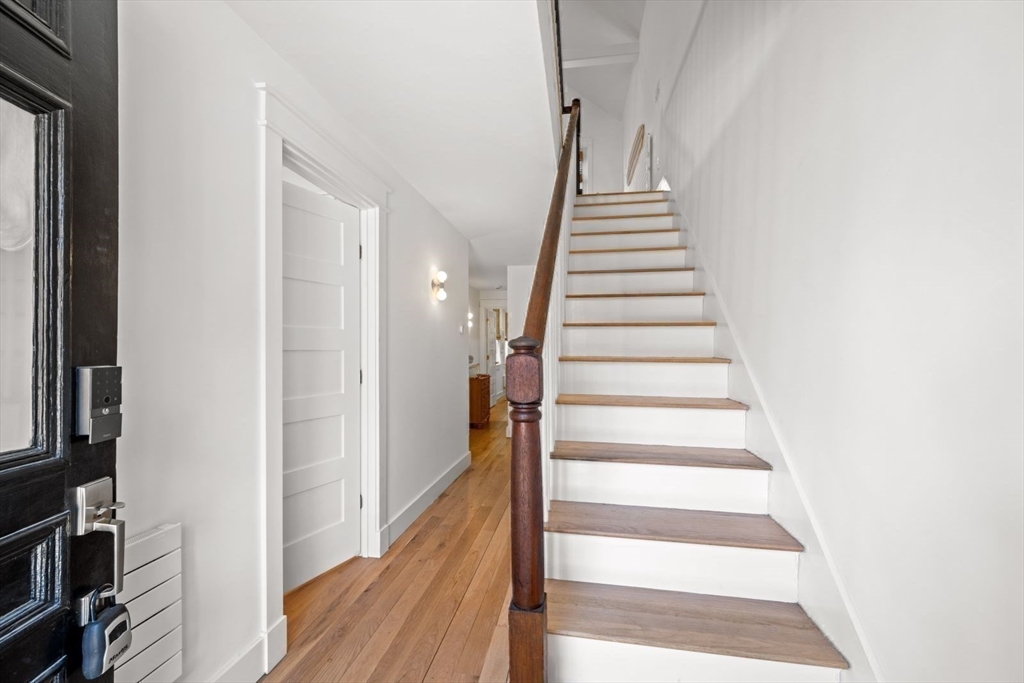 22 Mitchell Street, Unit 1 Boston, MA 02127 - Photo 17 of 41 a view of a hallway with wooden floor and entryway