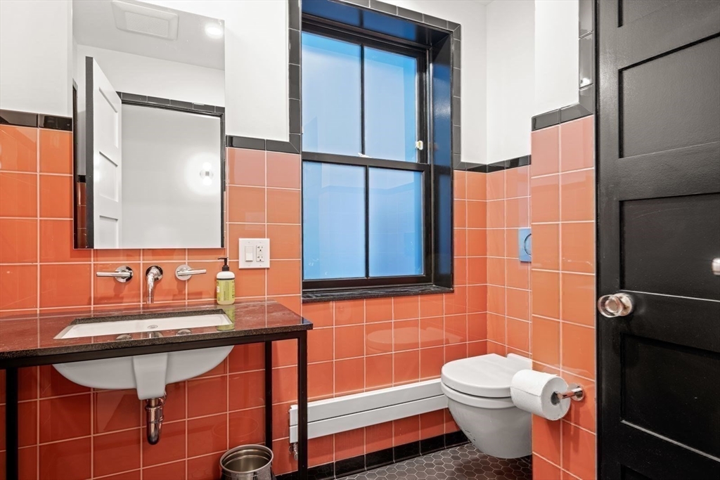 22 Mitchell Street, Unit 1 Boston, MA 02127 - Photo 28 of 41 a bathroom with a sink toilet and mirror
