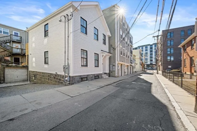 a view of a house with a street