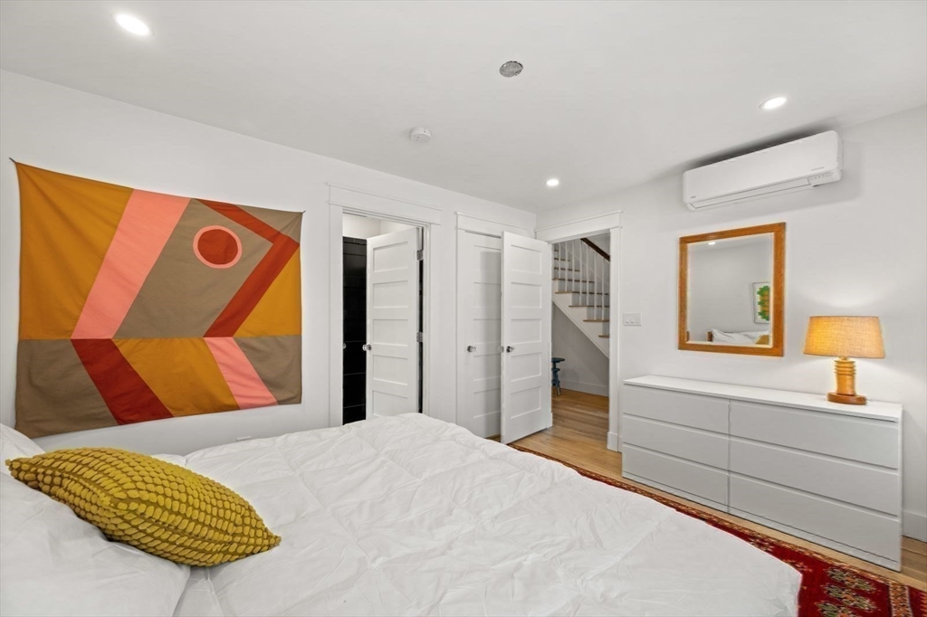 22 Mitchell Street, Unit 1 Boston, MA 02127 - Photo 34 of 41 a bedroom with a bed and a dresser