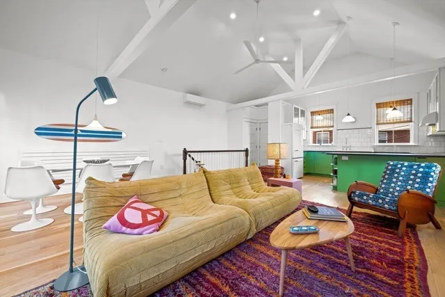 a bedroom with furniture and a wooden floor