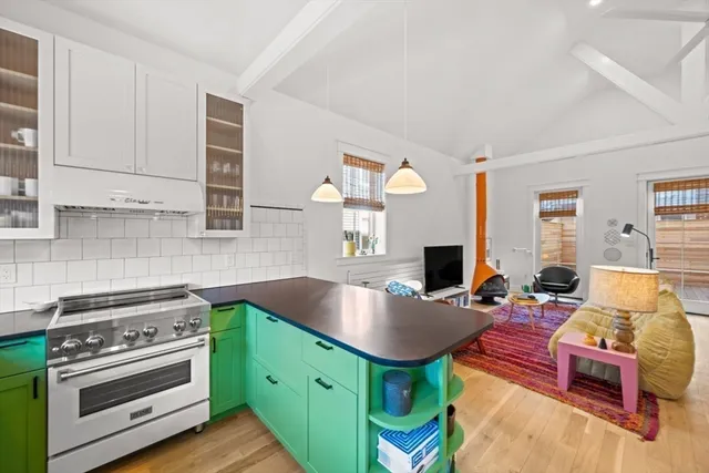 a kitchen with a stove and a refrigerator
