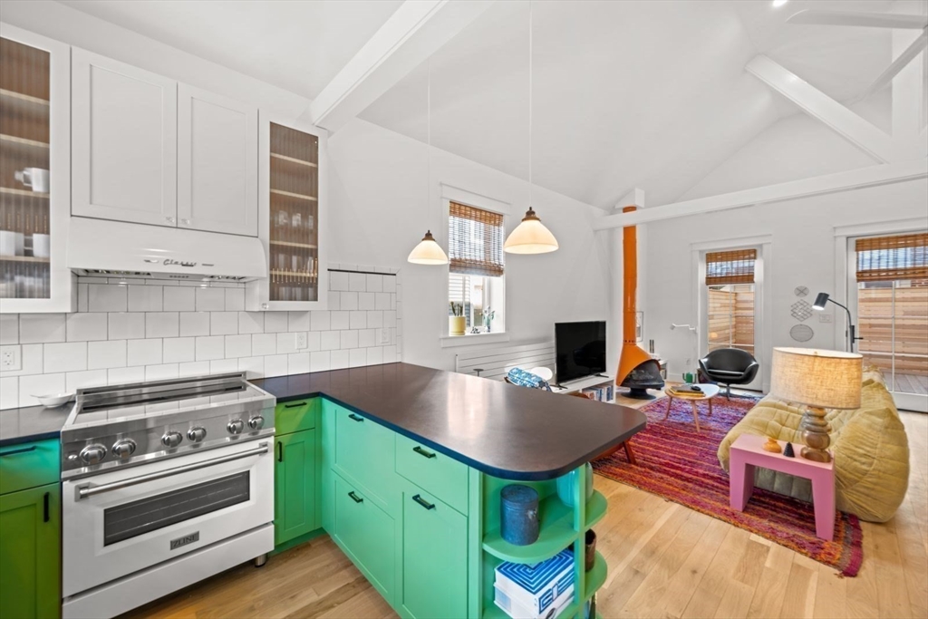 22 Mitchell Street, Unit 1 Boston, MA 02127 - Photo 7 of 41 a kitchen with a stove and a refrigerator