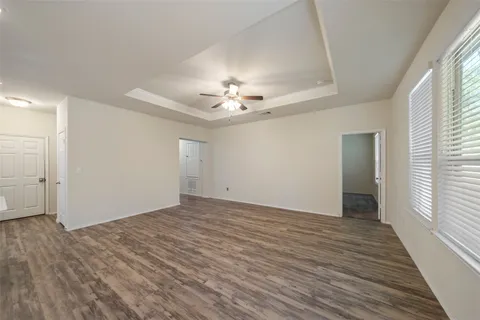 a view of a kitchen with kitchen island a sink stainless steel appliances and cabinets