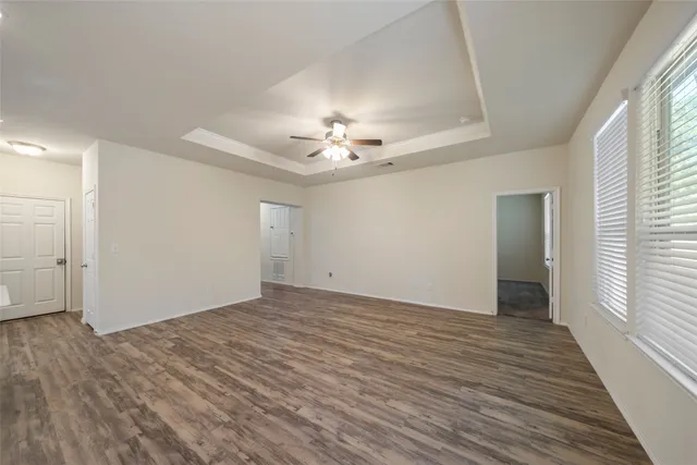 a view of a kitchen with kitchen island a sink stainless steel appliances and cabinets