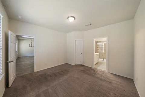 a backyard of a house with lots of green space and trees