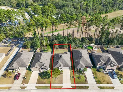 an aerial view of residential house with outdoor space