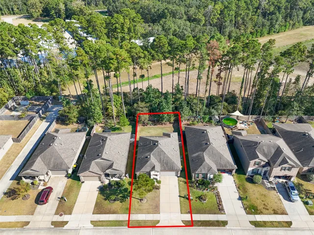 an aerial view of residential house with outdoor space