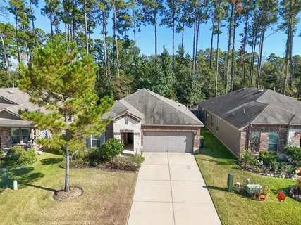 an aerial view of residential house with outdoor space