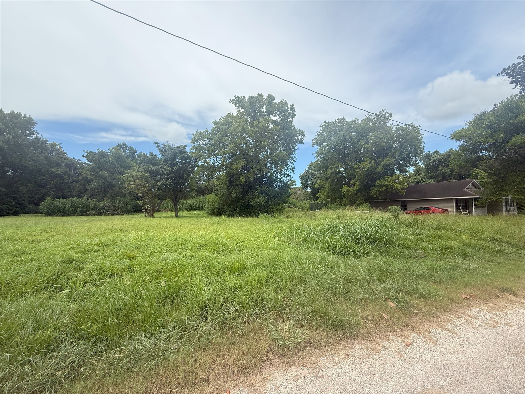 611 Trinity Street Liberty, TX 77575 - Photo 2 of 4 a backyard of a house with lots of green space