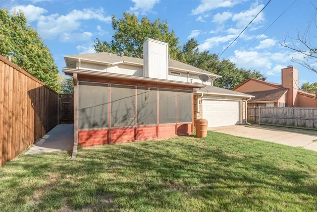 a view of backyard with swimming pool and seating