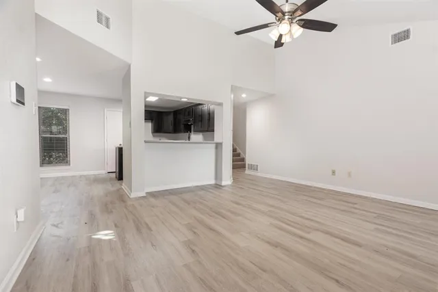 a view of a livingroom with a kitchen
