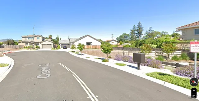 a view of a street with a building in the background