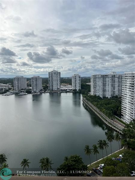 a view of a lake with lots of residential buildings