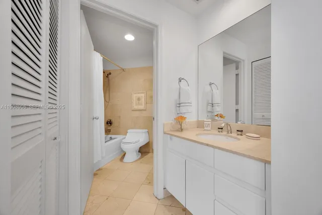 a balcony with chairs and table