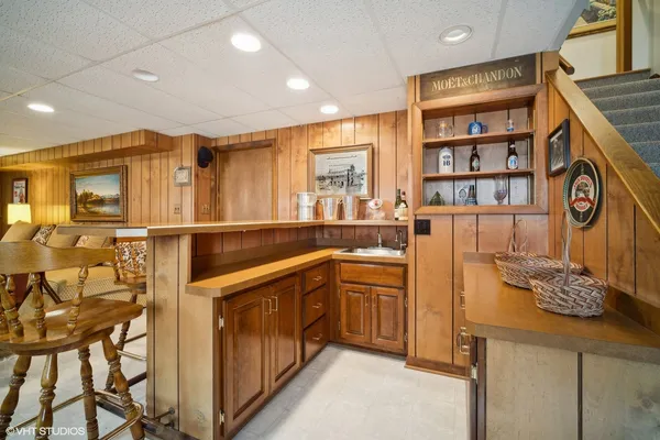 a kitchen with stainless steel appliances granite countertop a sink and cabinets