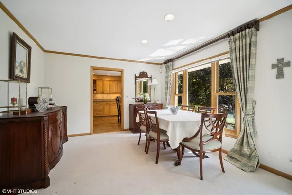 a view of a dining room with furniture window and outside view