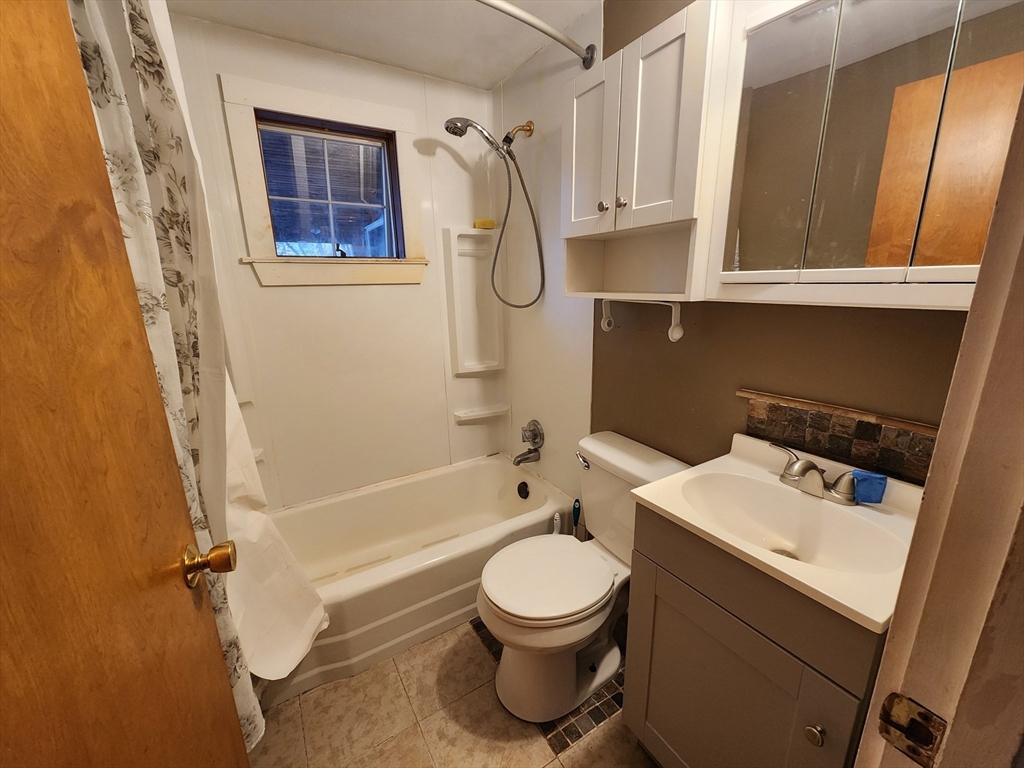 68 Hudson Road Stow, MA 01775 - Photo 11 of 39 a bathroom with a toilet sink and bathtub