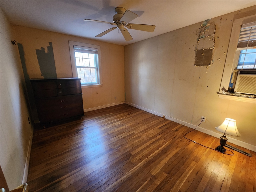 68 Hudson Road Stow, MA 01775 - Photo 13 of 39 a view of empty room with wooden floor and fan