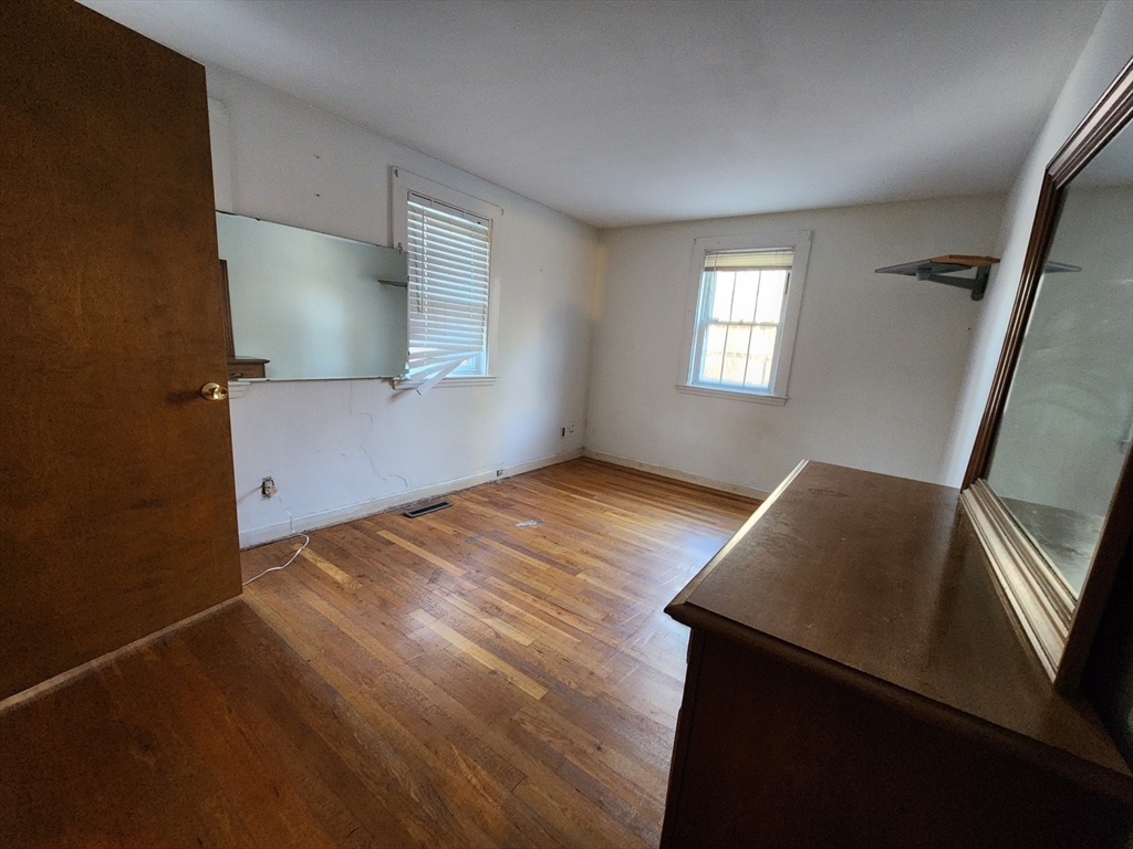 68 Hudson Road Stow, MA 01775 - Photo 14 of 39 a view of an empty room and wooden floor