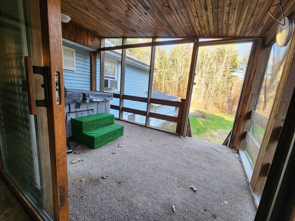 68 Hudson Road Stow, MA 01775 - Photo 20 of 39 a view of a porch with couches and wooden floor