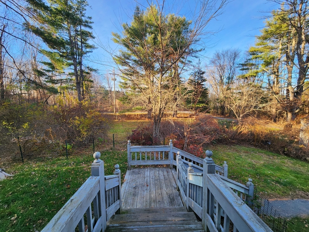 68 Hudson Road Stow, MA 01775 - Photo 22 of 39 a view of a deck and yard with green space