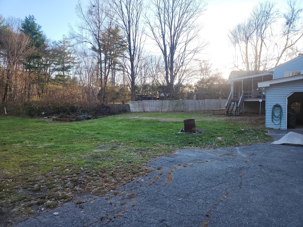 68 Hudson Road Stow, MA 01775 - Photo 29 of 39 a view of a backyard with large trees