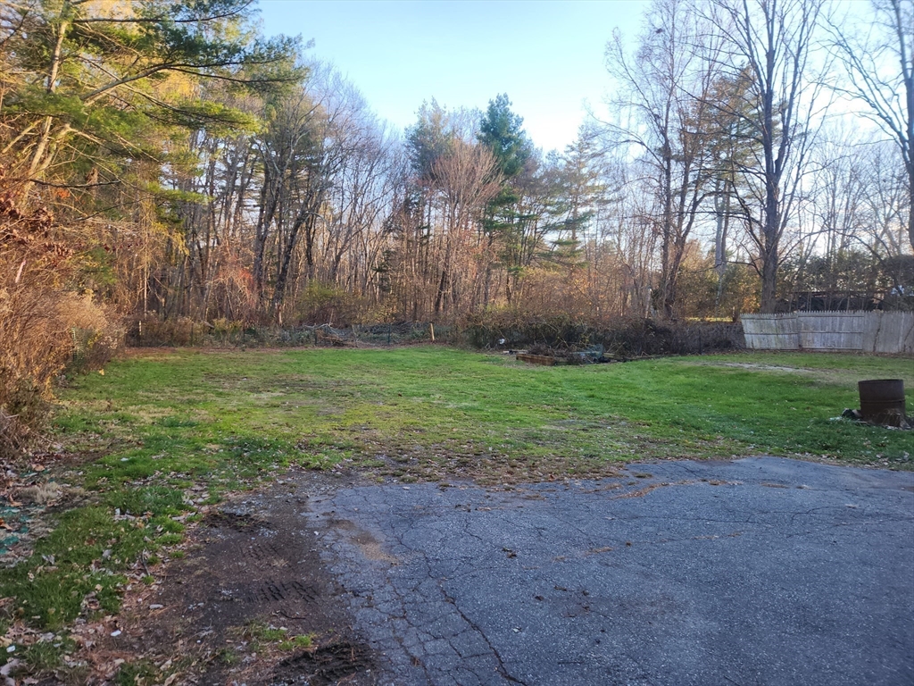 68 Hudson Road Stow, MA 01775 - Photo 30 of 39 a view of a yard with a house in the background