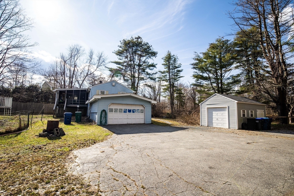 68 Hudson Road Stow, MA 01775 - Photo 37 of 39 a view of a house with a yard covered in snow